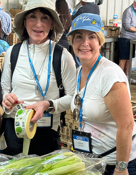 Nadine Pertnoy and Dalia Levine pitched in packing produce at a farm on the Gaza border.